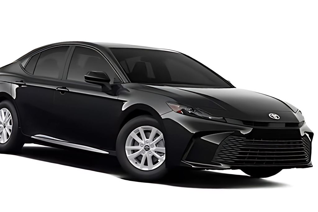 A black Toyota Camry with dark ceramic window tint, giving it a sleek and stylish appearance. The high-quality tint enhances privacy, reduces glare, and provides superior heat rejection. The smooth design and tinted windows highlight the benefits of ceramic window tinting for both aesthetics and protection.