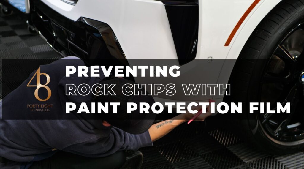 Technician applying paint protection film to the lower front fender of a white car in Surprise Arizona to help prevent rock chips and preserve the paint finish.