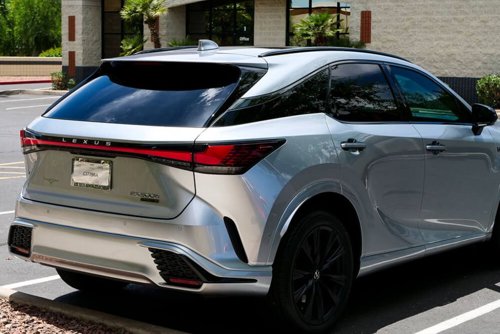 Silver Lexus RX 500h SUV parked in a sunny Arizona lot, showcasing how Superior Heat-Blocking Film can protect interiors from intense infrared heat and sunlight glare.